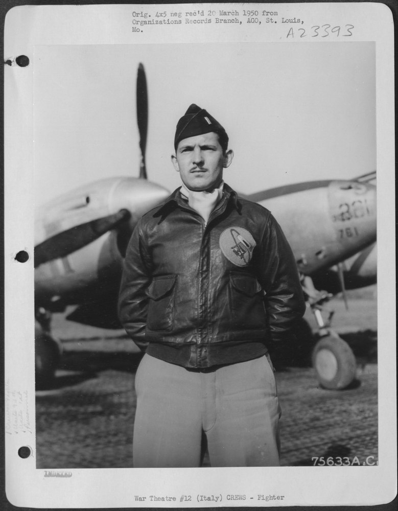Lt Schaper beside P-38 in Italy