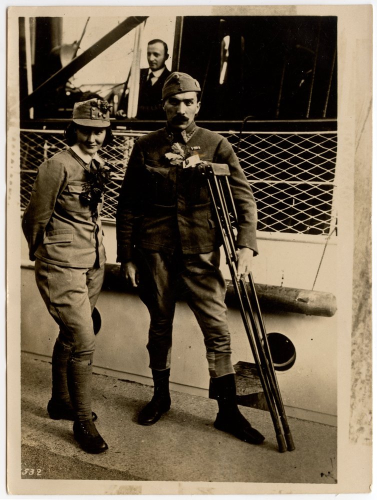 Man and woman in military uniforms standing together