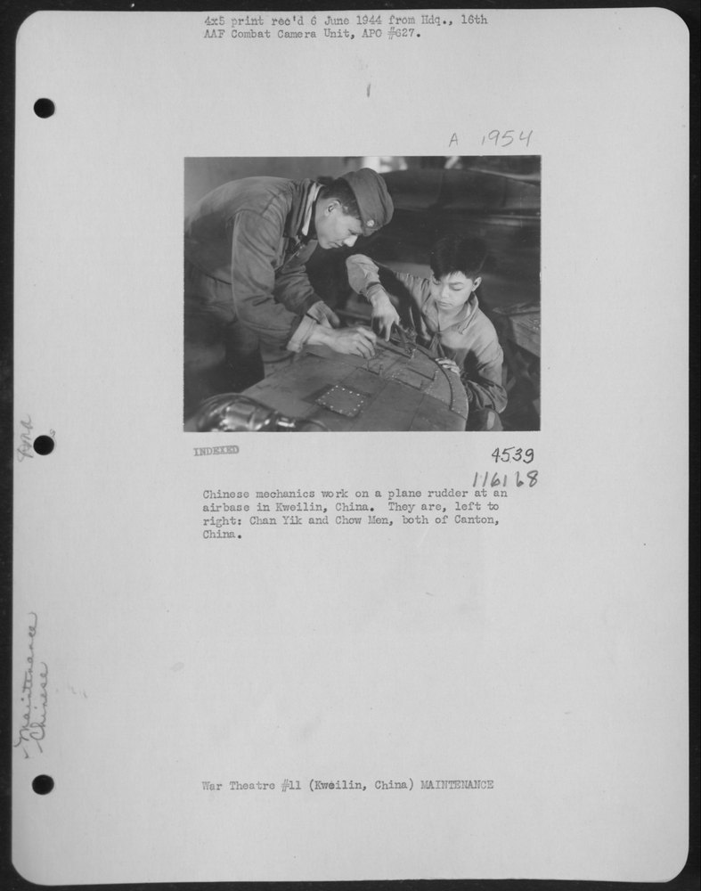 Mechanics work on plane rudder at Kweilin airbase