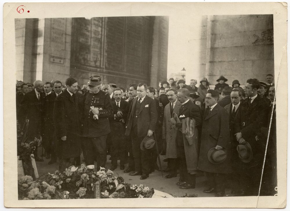 Men in formal attire at a memorial