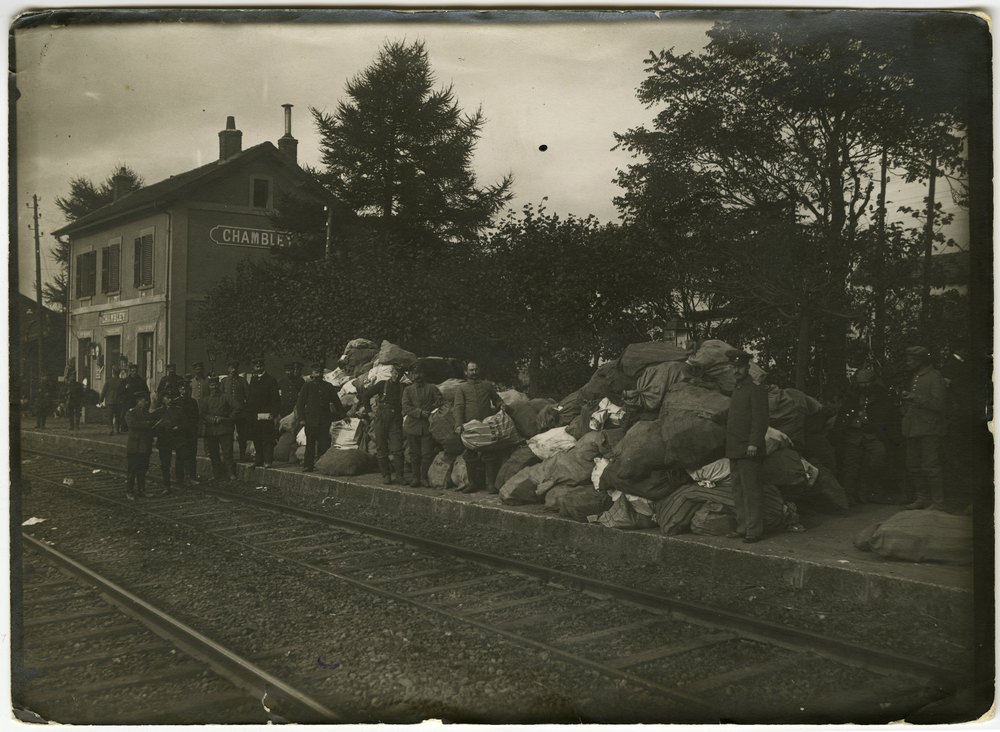 Men in military uniforms on railway platform