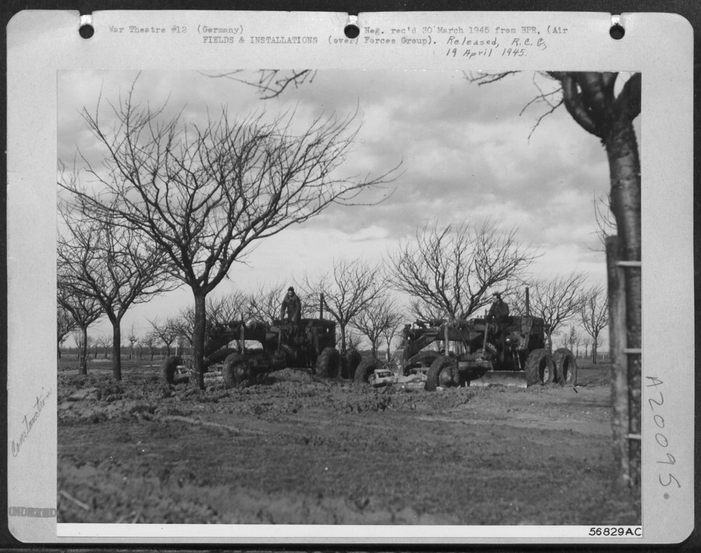 Men levelling land in Germany