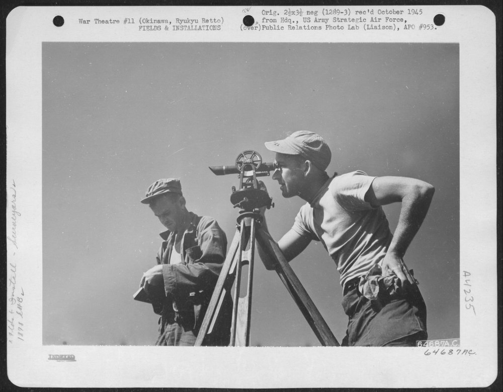 Men survey for airstrip on Okinawa
