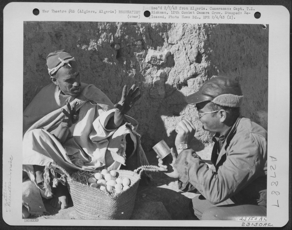 Men trading rations Algiers