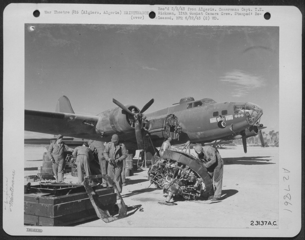 Men working on B-17 motor in Algiers