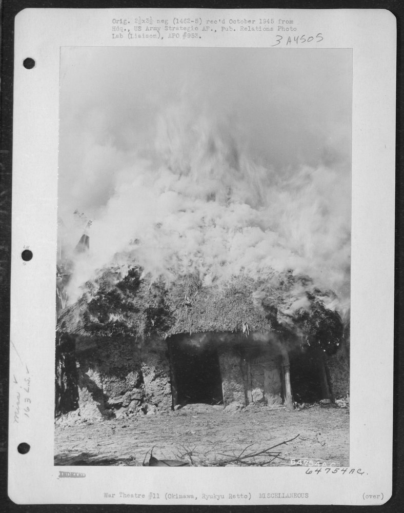 Native huts burning on Okinawa