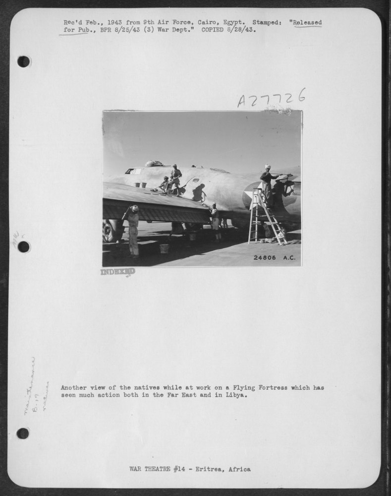Natives at work on Flying Fortress