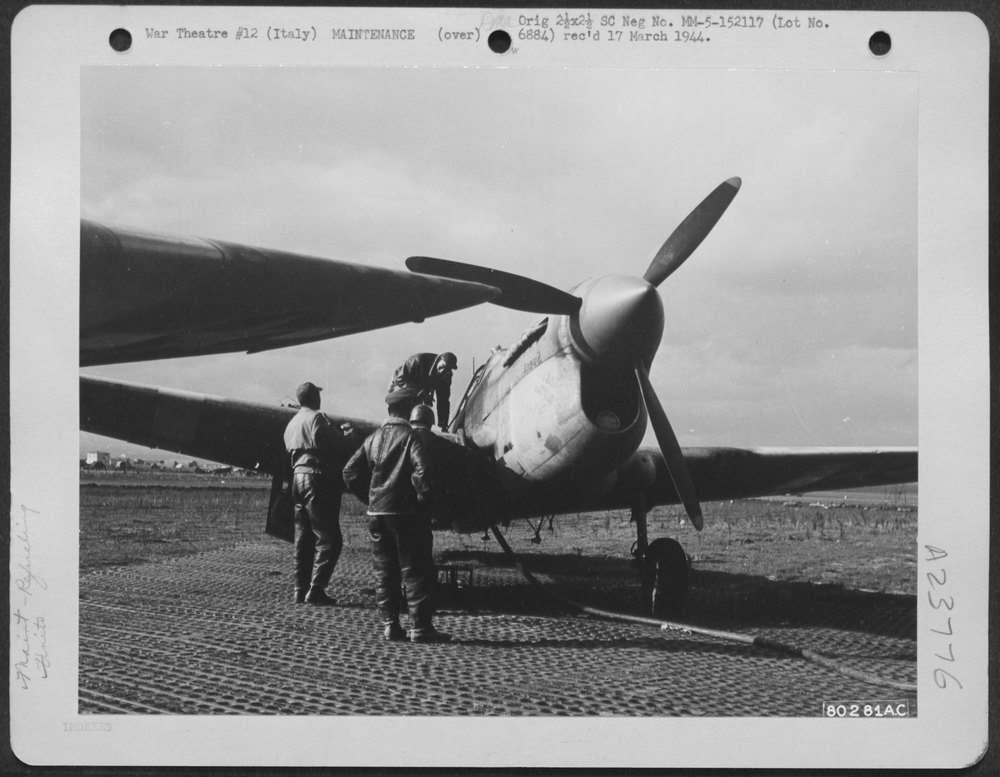 Negro Ground Crew Gasses P-40 In Italy