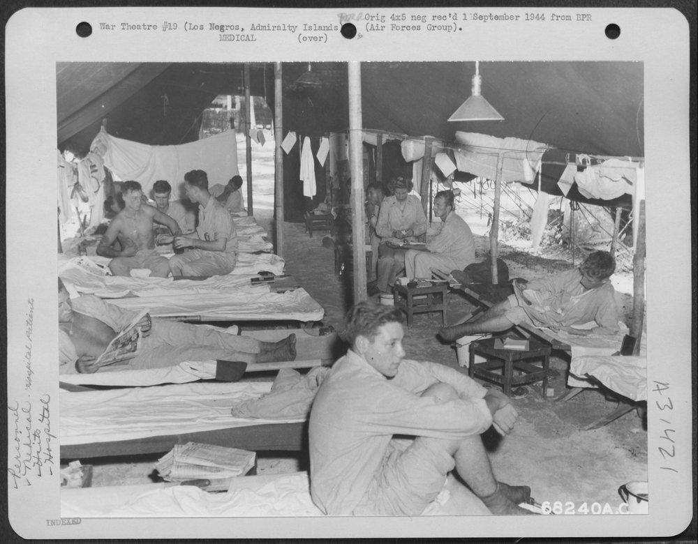 Nurse administers on Los Negros