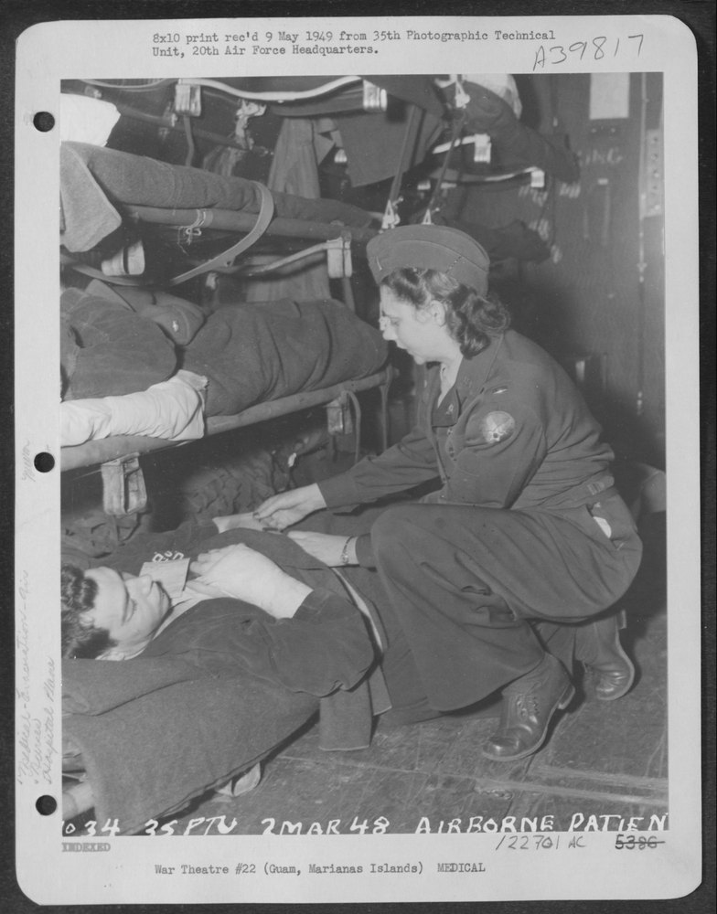Nurse on hospital plane over Guam