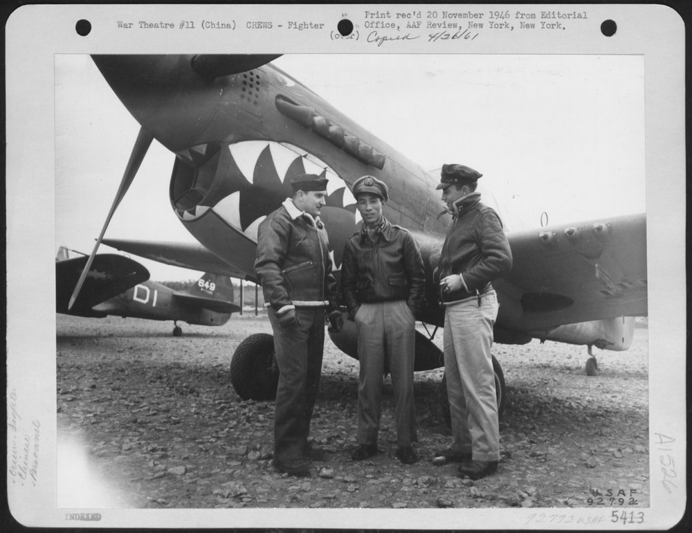 Officers by Curtiss P-40 in China