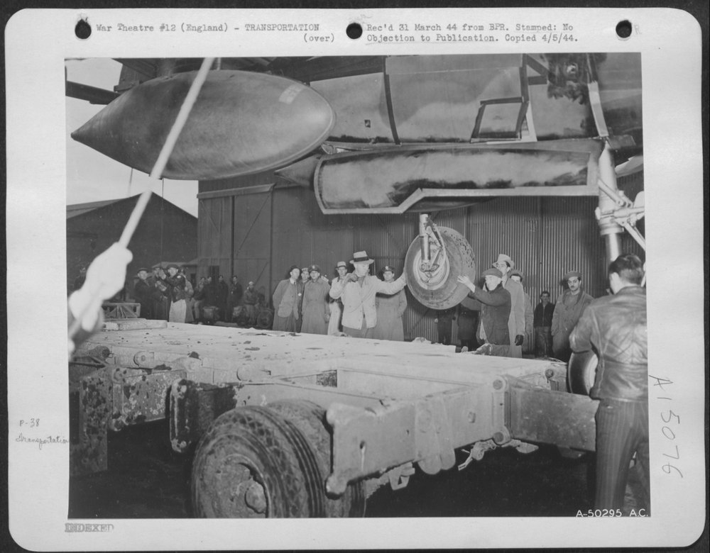 Onto the cradle of a giant trailer swings the Lightning, preparatory
