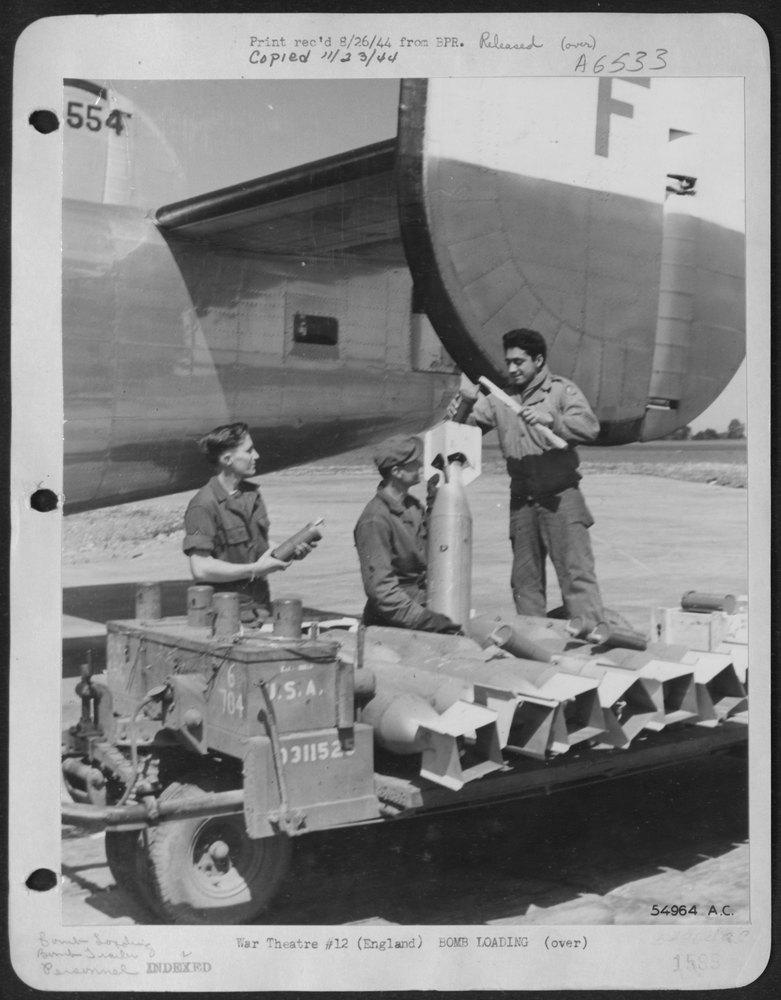 Ordnance men loading bombs in Liberators