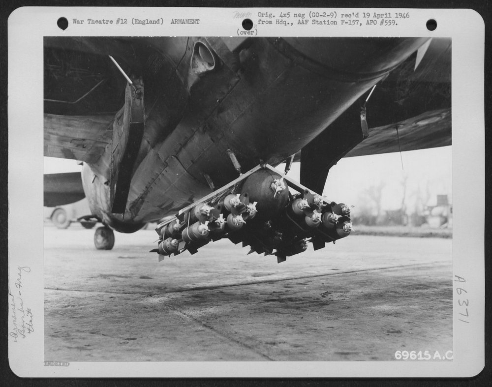 P-47 with fragmentation bombs over enemy installations
