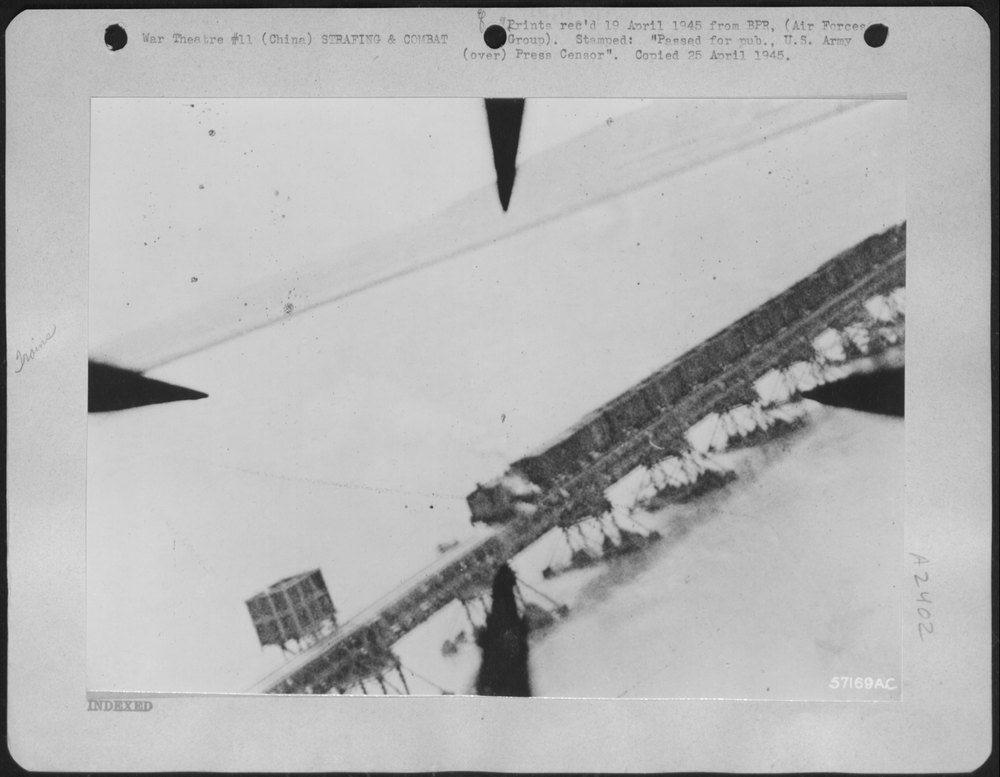 P-51 Mustangs target train on Yellow River bridge