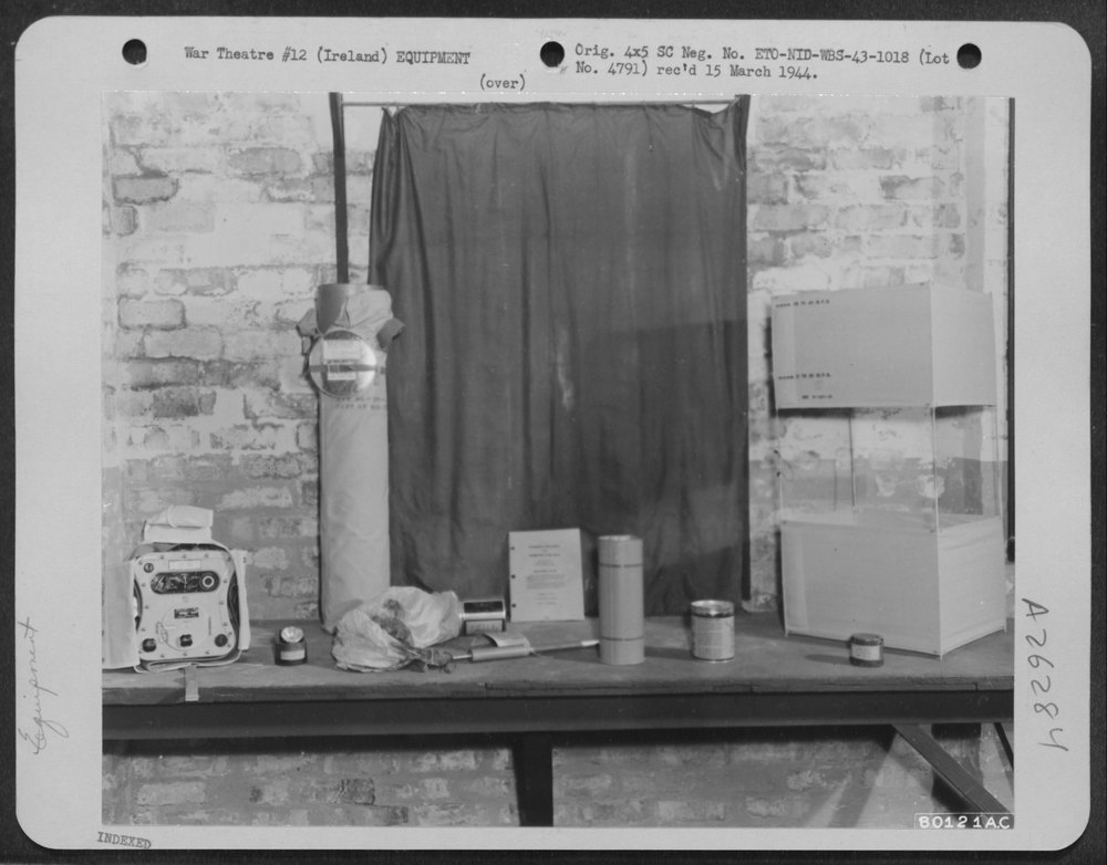 Photo showing from left to right, a dinghy radio set; a signal lamp