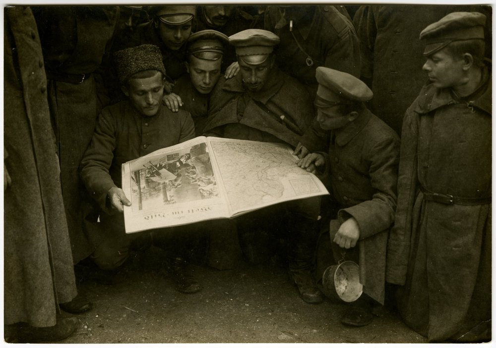 Prisoners reading illustrated and daily newspapers