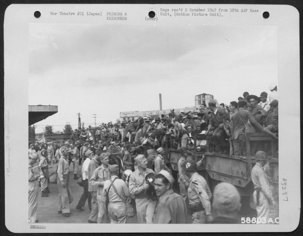 Released Prisoners Of War Climbing On Trucks At Yokohama Station