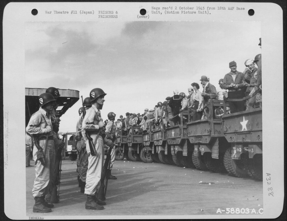 Released Prisoners Of War Climbing On Trucks At Yokohama Station