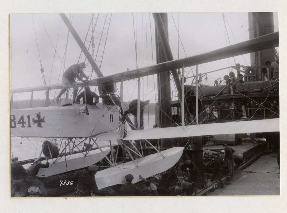 Return of the Wolf after a 15 month cruise. Taking the hydroplane Woelfchen off the deck. It rendered excellent reconnaissance service during the cruise of the Wolf