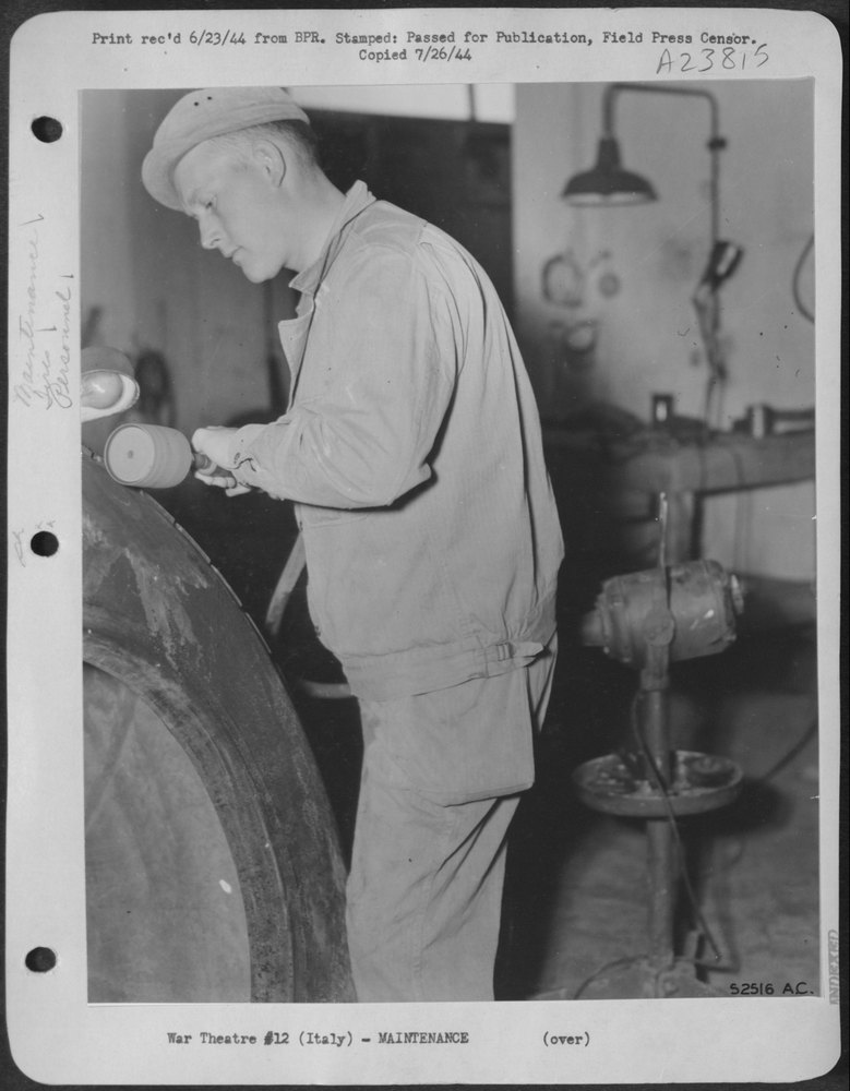 Pfc Robert Frick Puts the Finishing Touches on the Tire