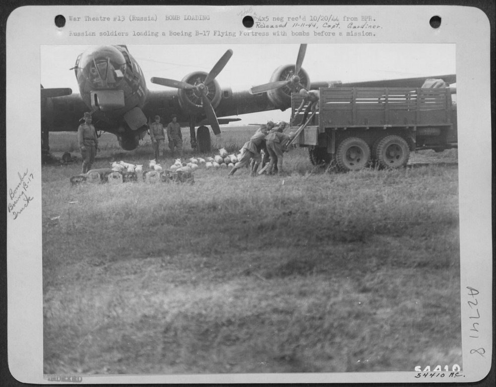 Russian soldiers load B-17 Flying Fortress