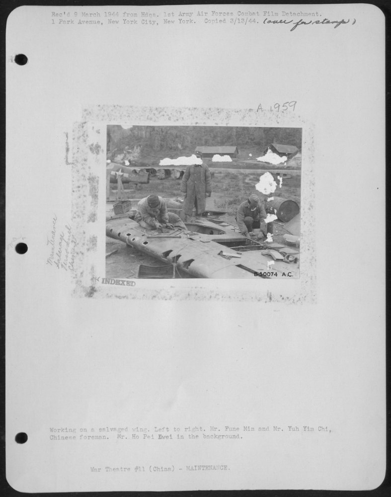 Salvaged wing with Chinese workers