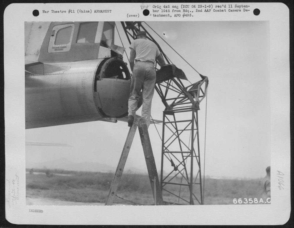 Sgt Calvin Brown with B29 in China