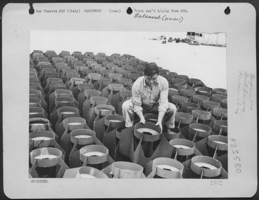 Sgt Drury with B-24 Liberator bombs in Italy