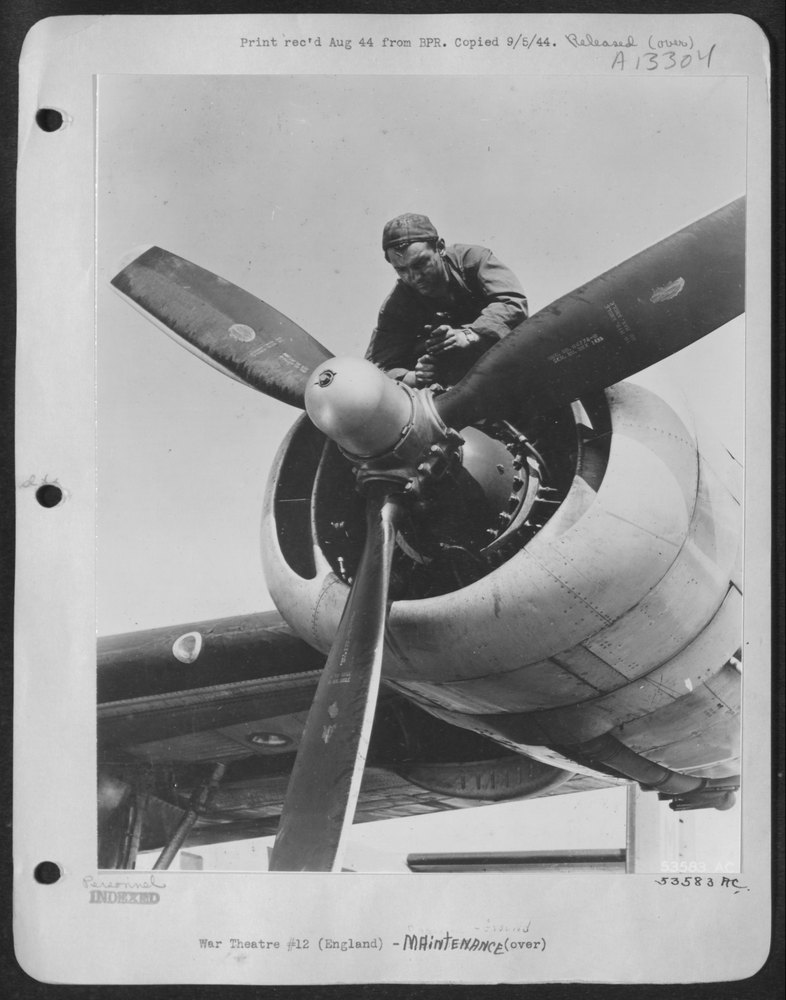Sgt Dwyer with B-24 in England