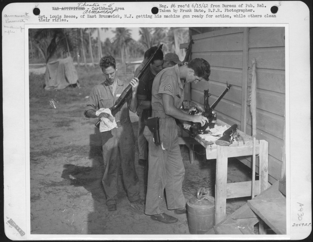 Sgt. Louis Reese, of East Brunswick, N.J. getting his machine gun