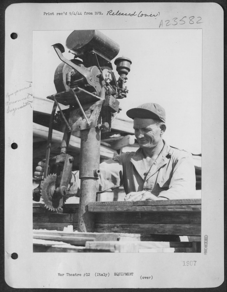 Sgt Smith builds power saw at B-24 base