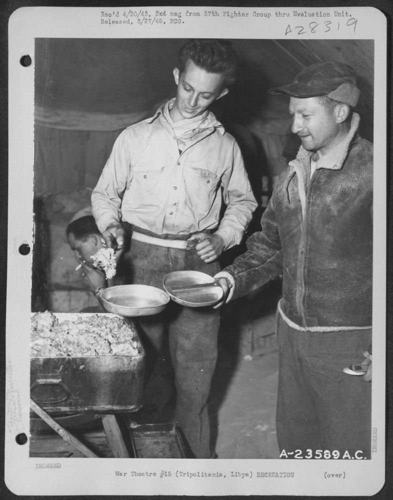 Sgt Thomas serves stew in Libya