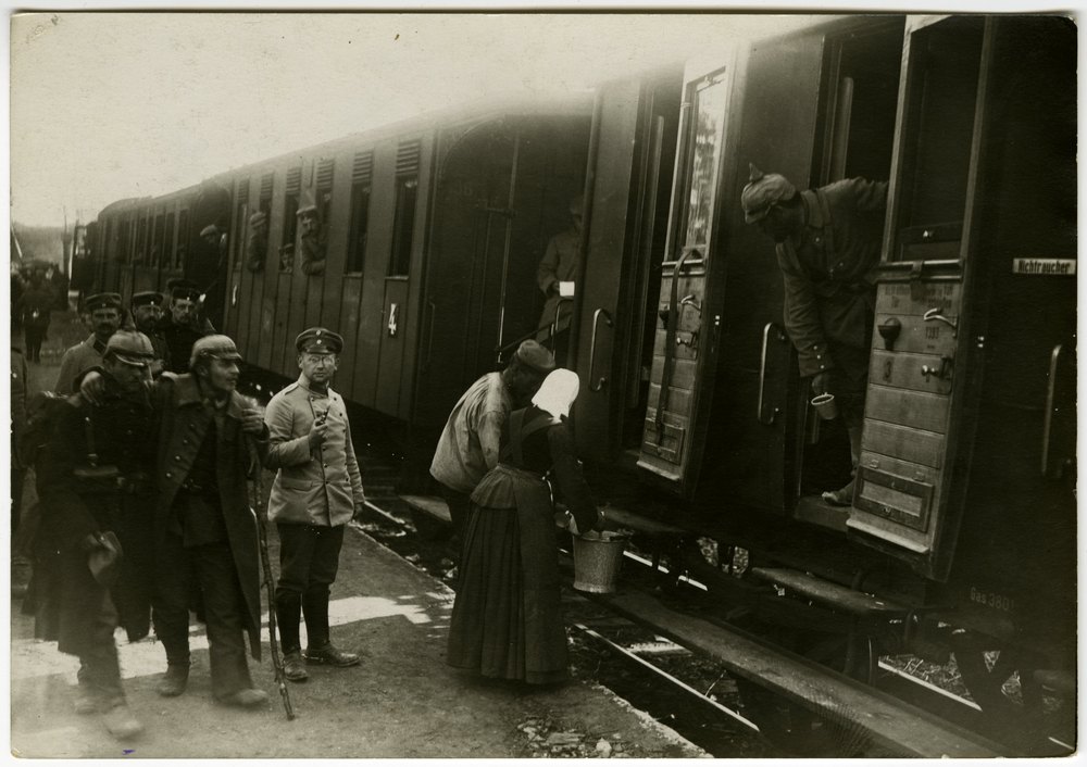 Soldiers boarding a train with wounded