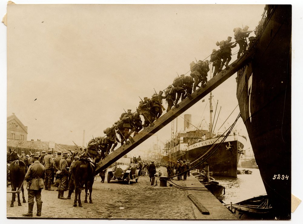 Soldiers boarding a transport ship