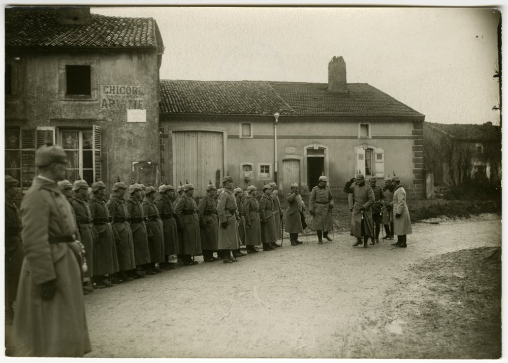 Soldiers in formation in a courtyard
