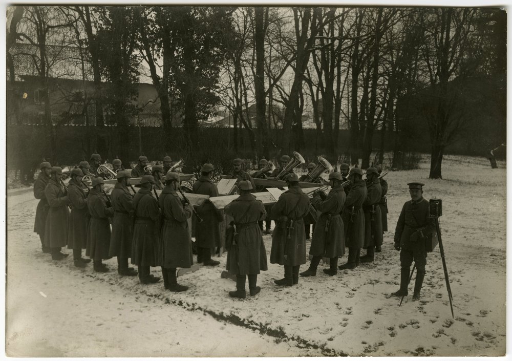 Soldiers play music in a French castle courtyard