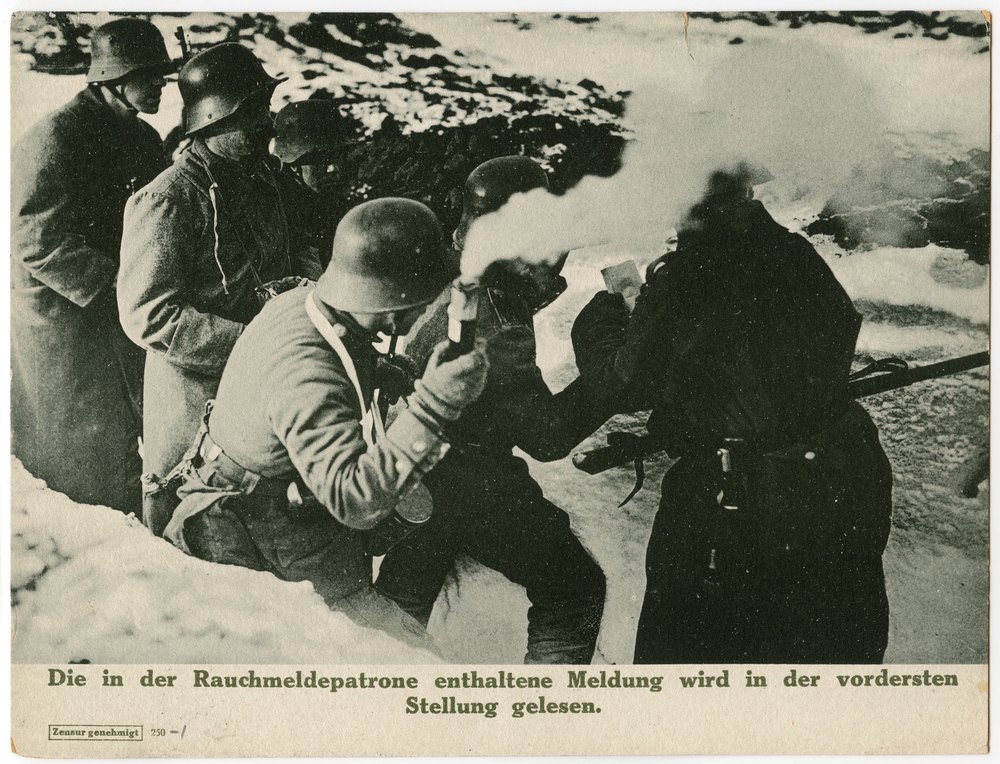 Soldiers reading message in snowy environment