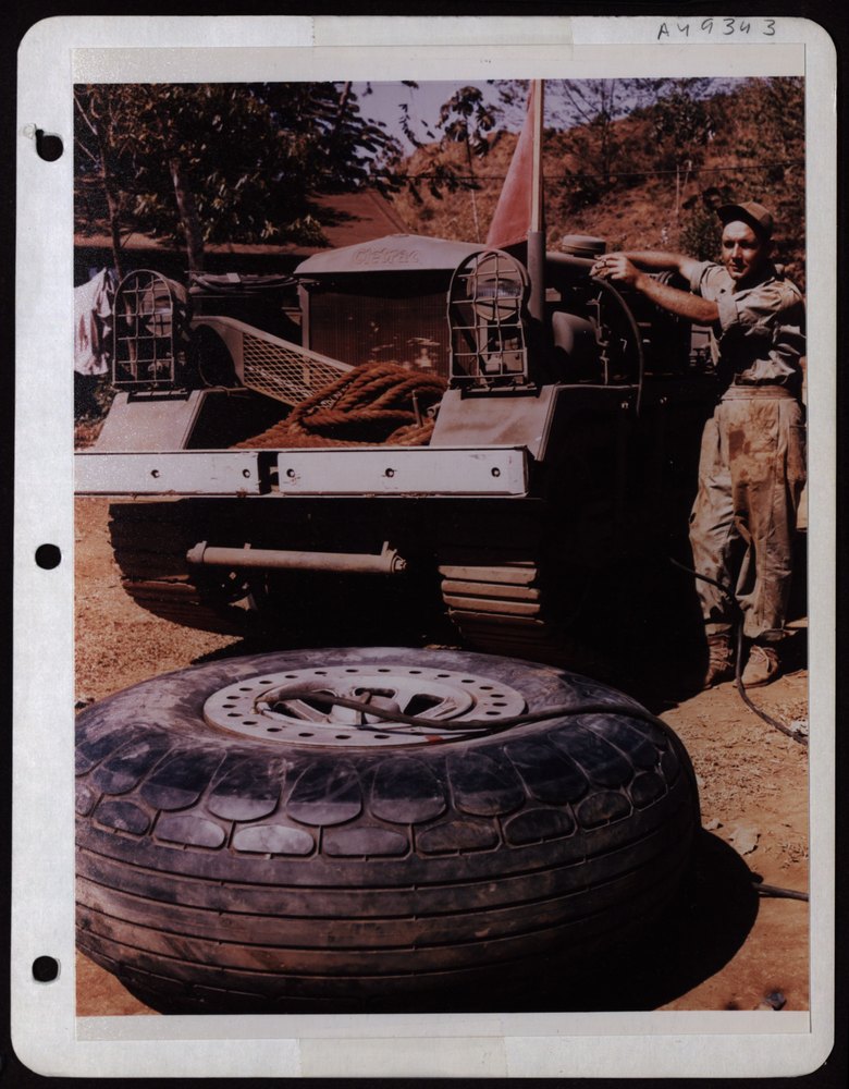 Ssgt Masburn inflates bomber tire Panama