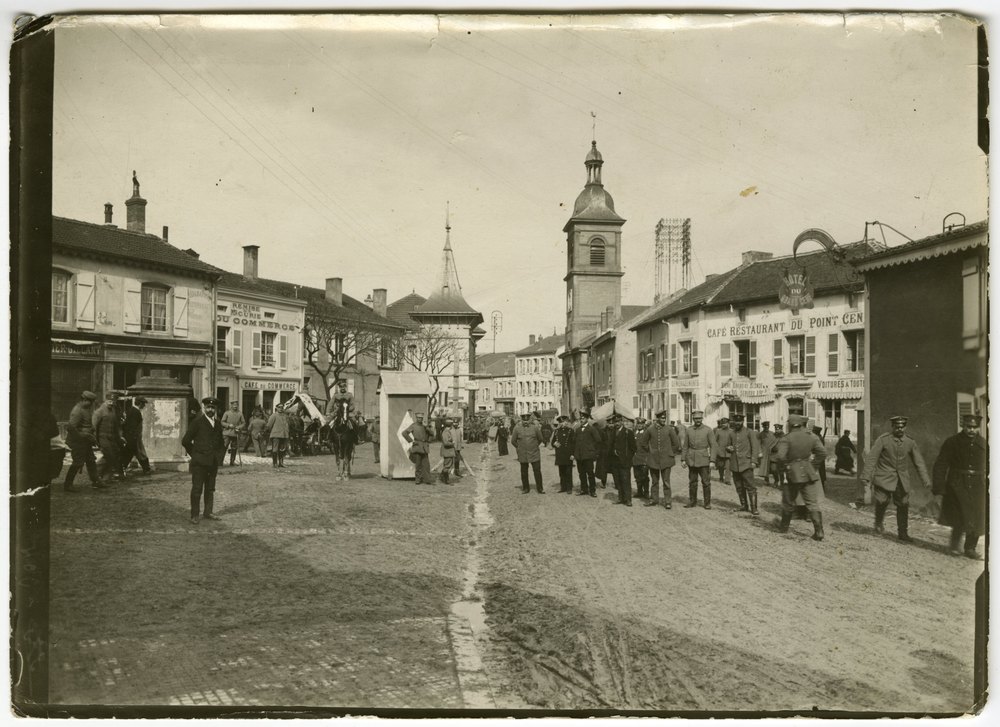 Street scene in Conflans with soldiers and horse