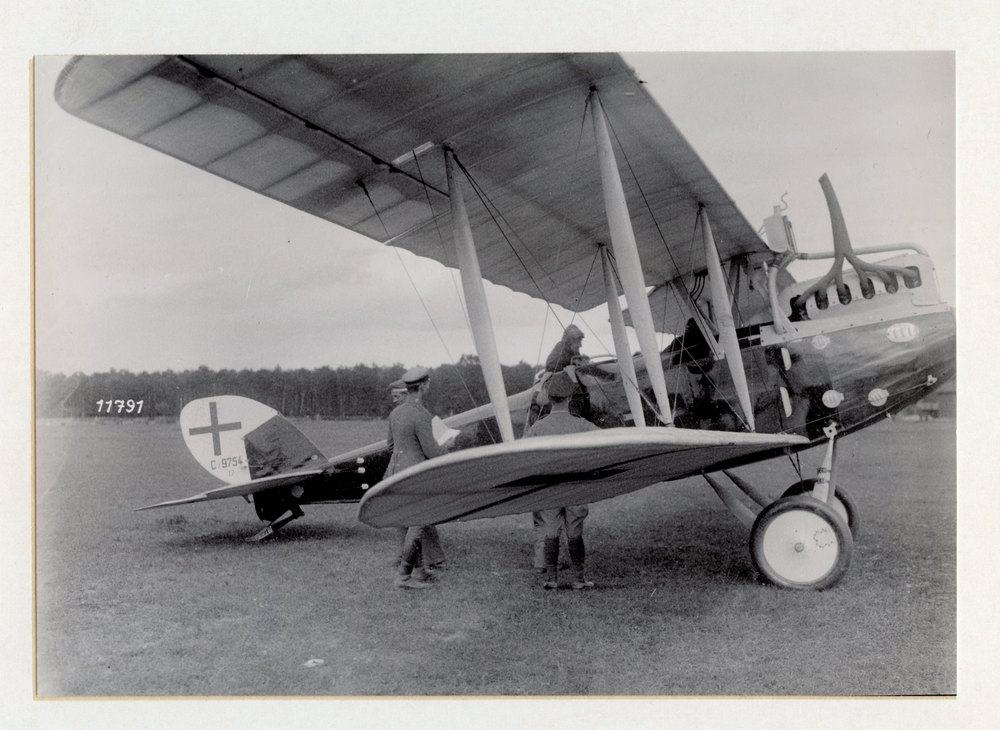 The air port of a German air-mail service station in Kiew. Loading the mail sacks into the plane