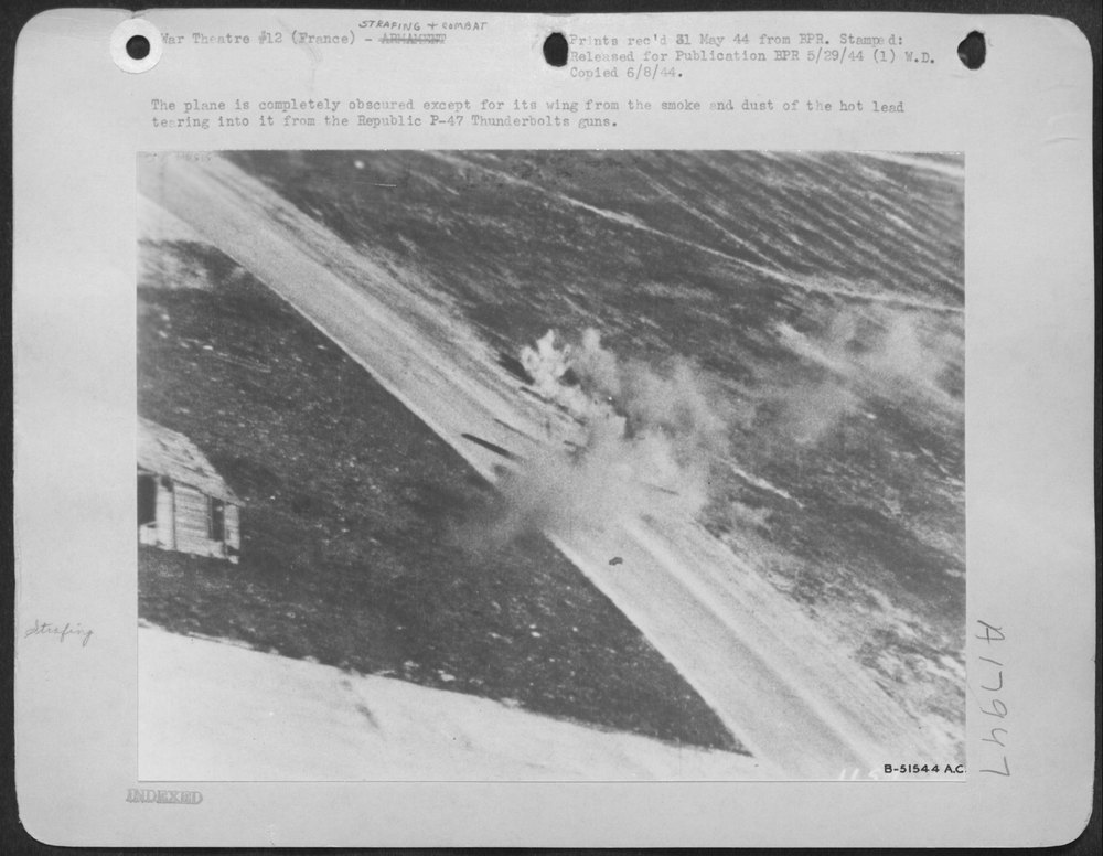The plane is completely obscured except for its wing from the smoke