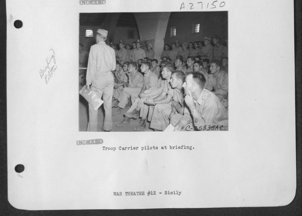 Troop Carrier pilots at briefing