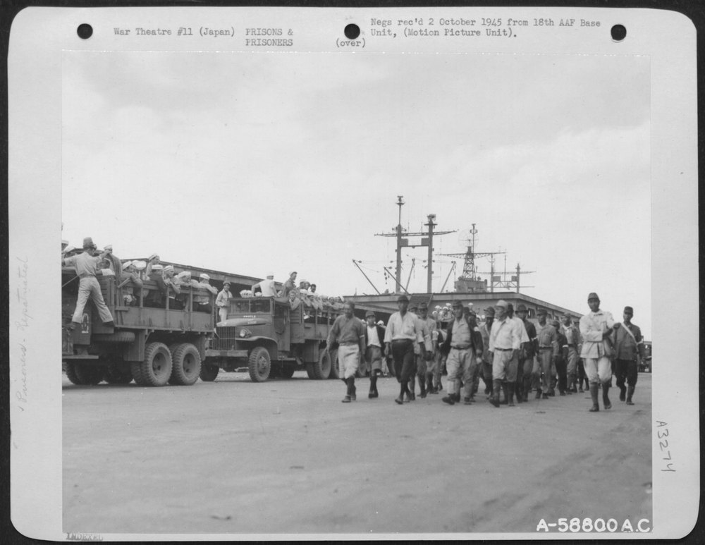 Trucks On Yokohama, Japan, Loaded With Released Prisoners Of War