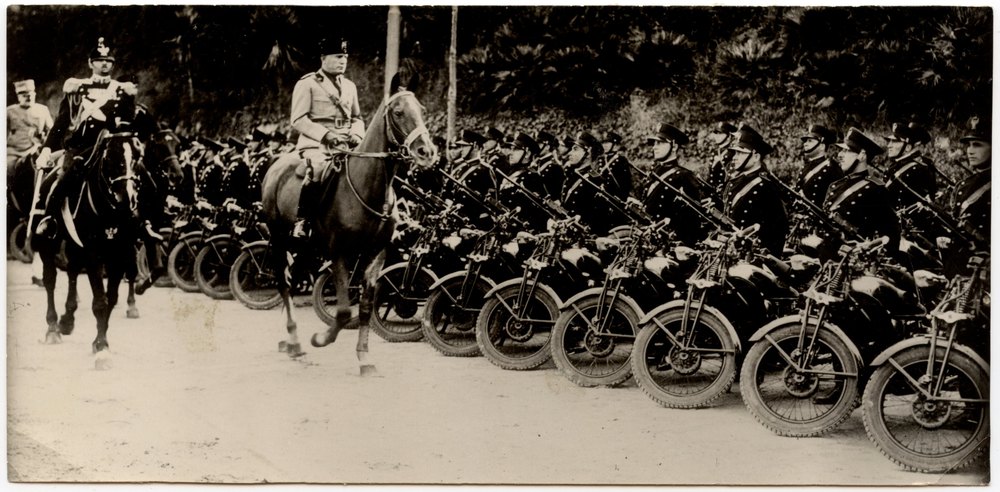 Uniformed men on motorcycles and horseback