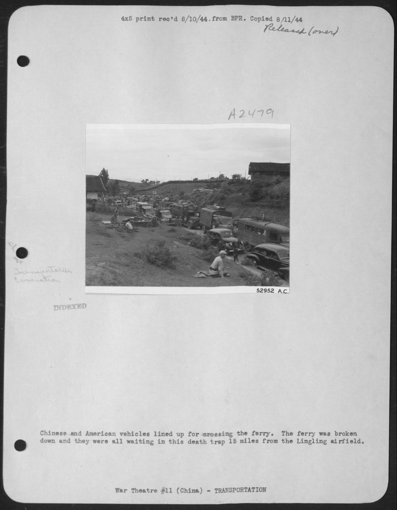 Vehicles waiting near Lingling airfield