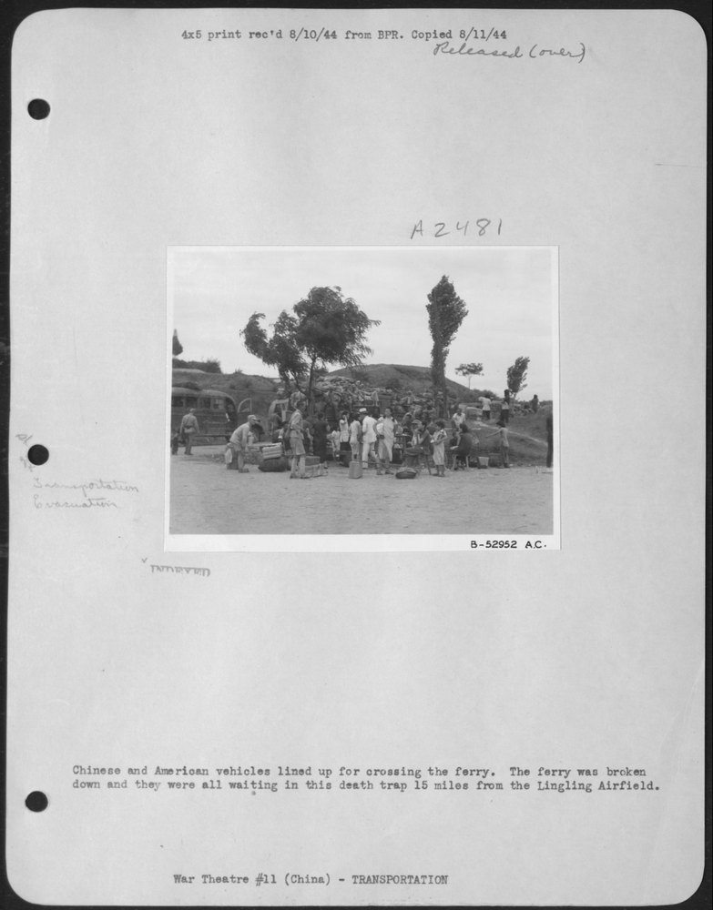 Vehicles waiting near Lingling airfield