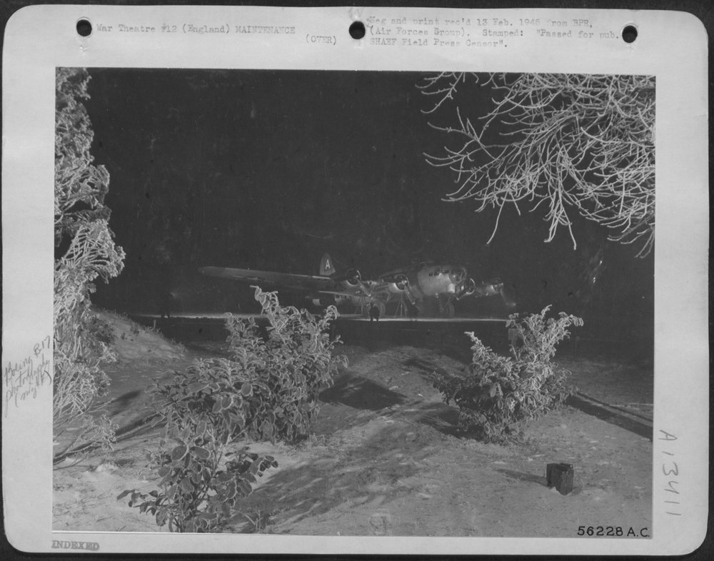 Winter tracery frames a U.S. 8th AF Boeing B-17 Flying ofrtress being